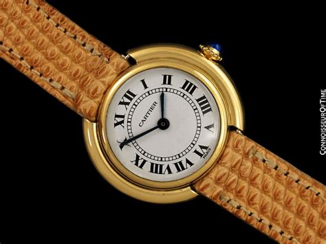 cartier ellipse 18k gold.